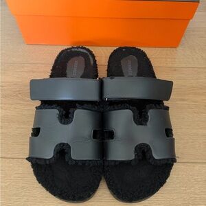 Hermès Black Shearling Chypre Sandals
